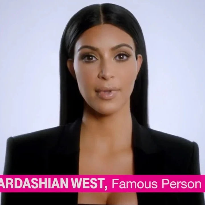 Woman in a black outfit with text identifying her as Kim Kardashian West on a light gray background